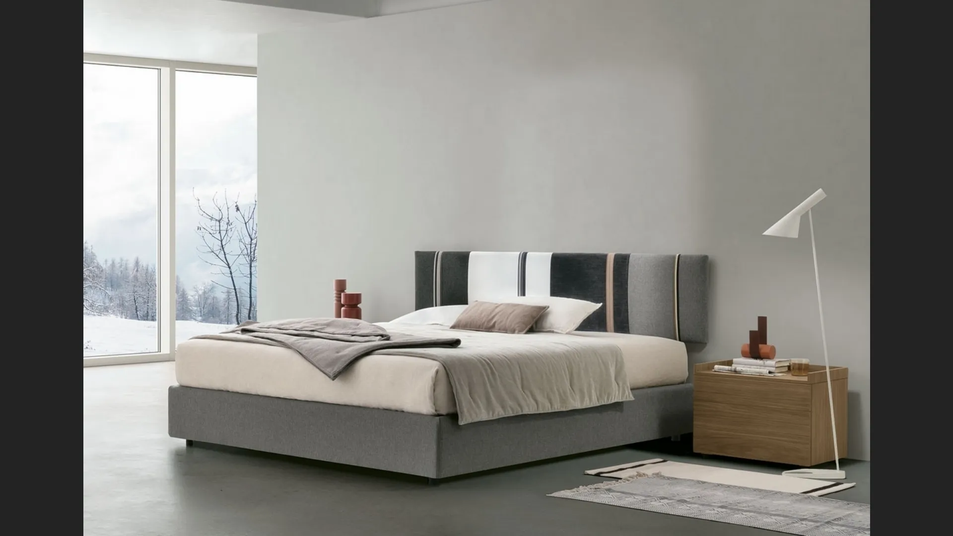 Letto sommier Diagonal con box contenitore e pannello testiera di Tomasella